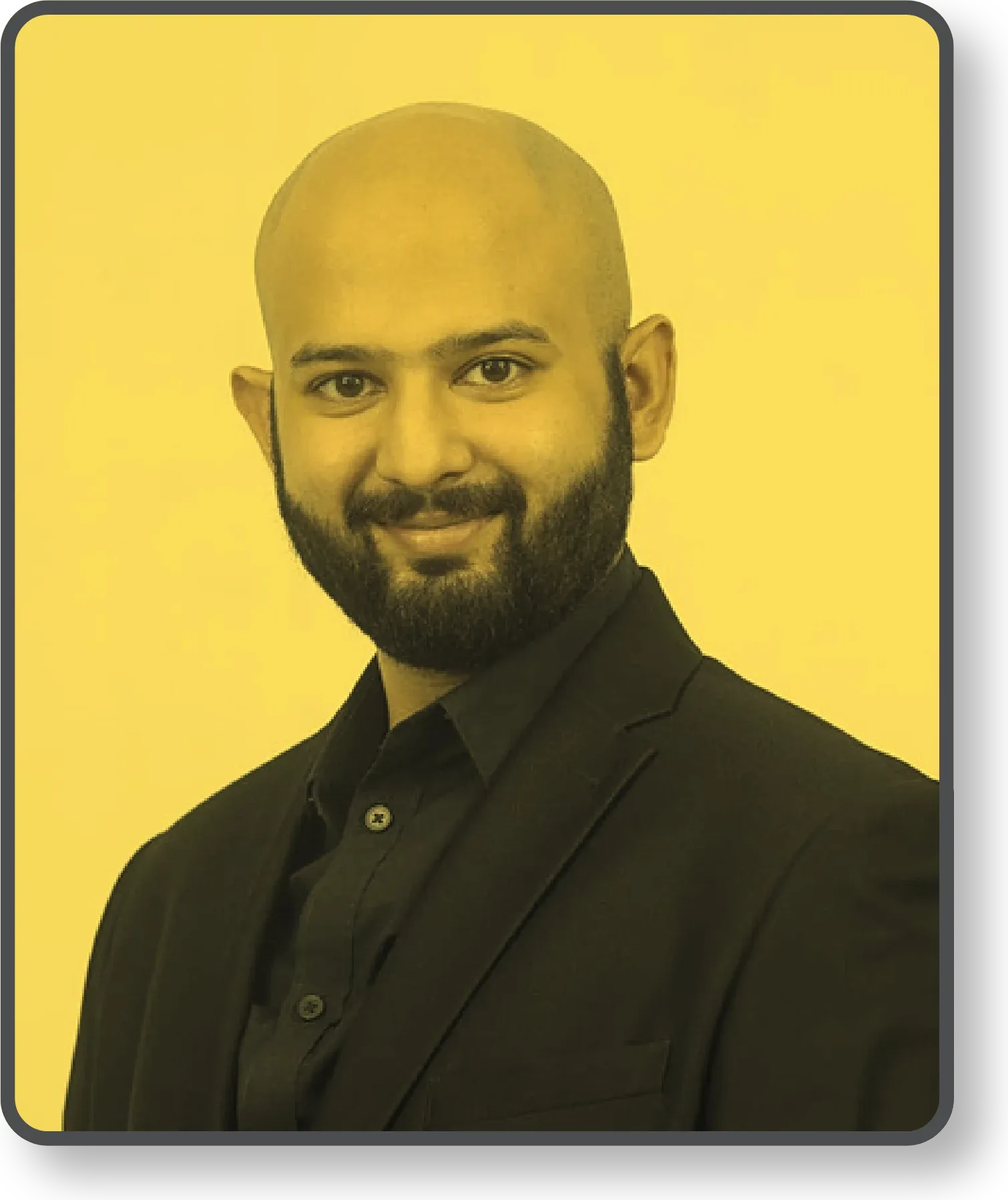 Ramit Sharan, smiling, in a dark blazer against a yellow background